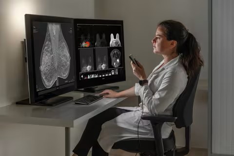 Radiologist reviewing studies on the Medsynapse PACS viewer